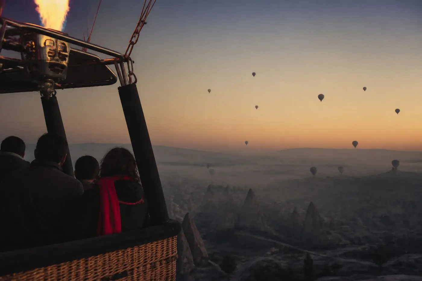 Sunrise balloon flight over the valleys